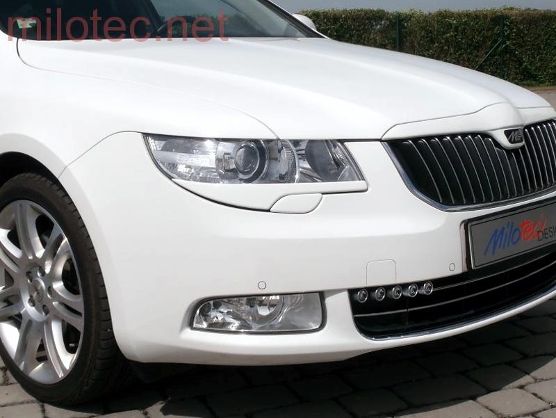 Kryty světlometů (mračítka), ABS černý - Škoda Superb II.